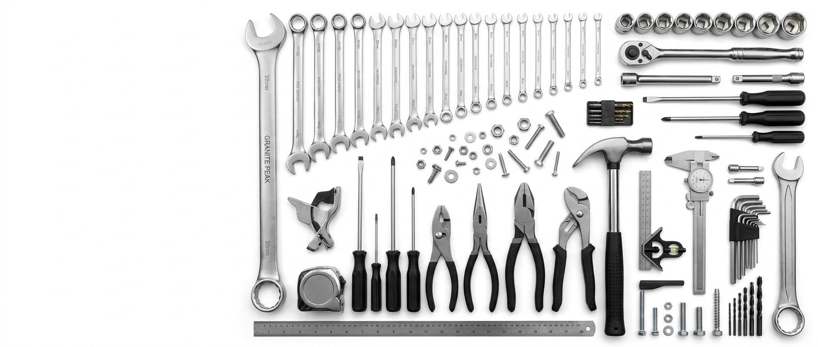 A complete professional tool kit laid out — wrenches, sockets, drivers, pliers and measuring tools